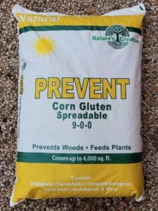 Photo shows a bag of spreadable corn gluten which should be applied to prevent weeds in February in Central Texas.